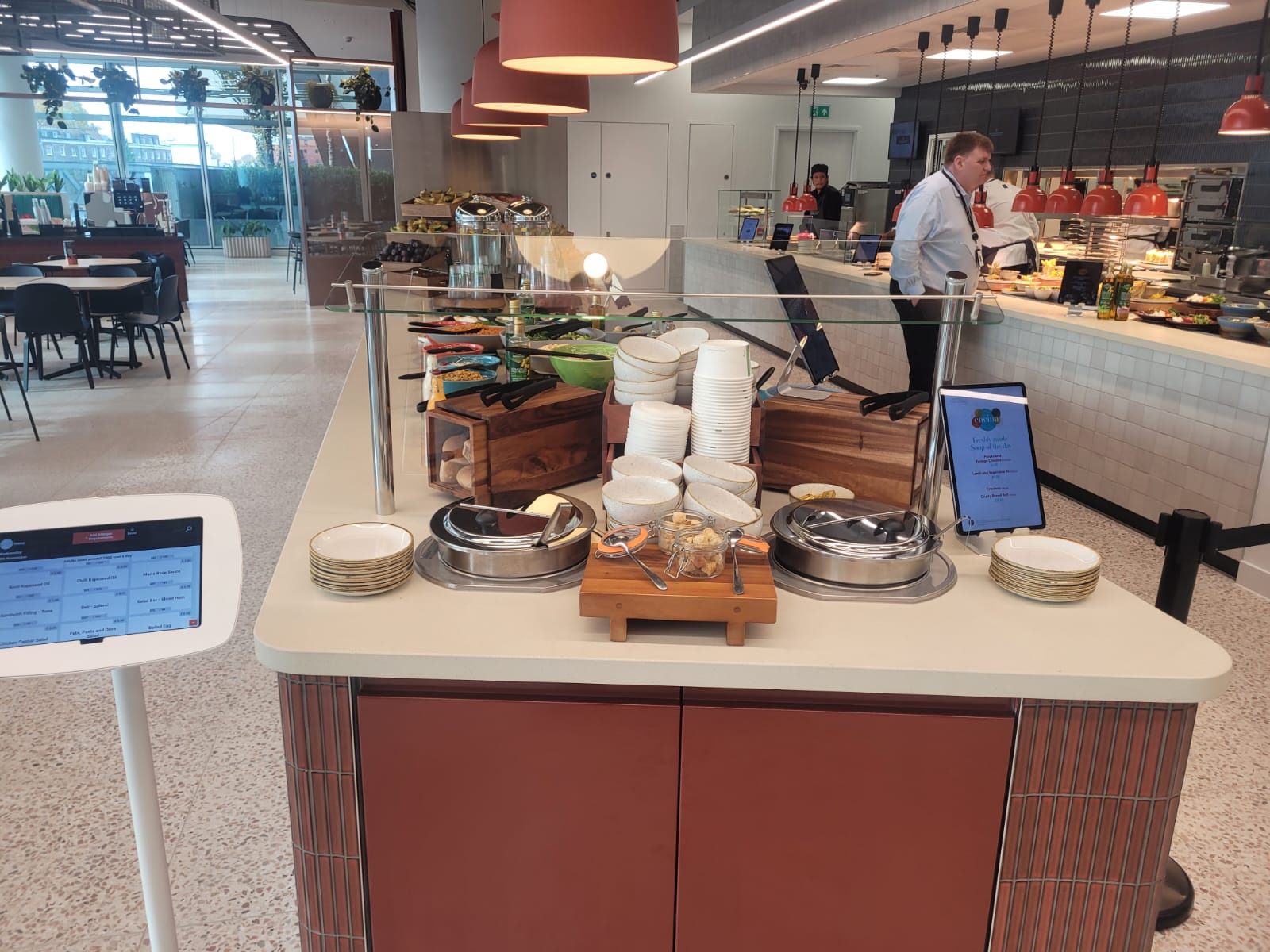 Back-to-back ambient display cases and chilled multidecks installed at Equinor's London headquarters, showcasing beverages and merchandise.