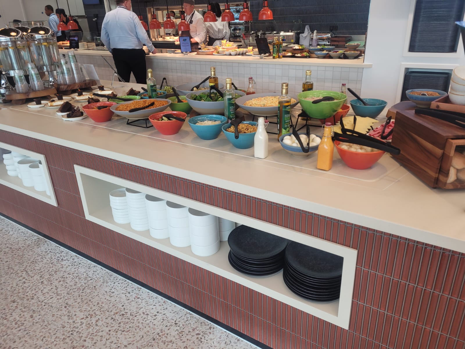 Back-to-back ambient display cases and chilled multidecks installed at Equinor's London headquarters, showcasing beverages and merchandise.