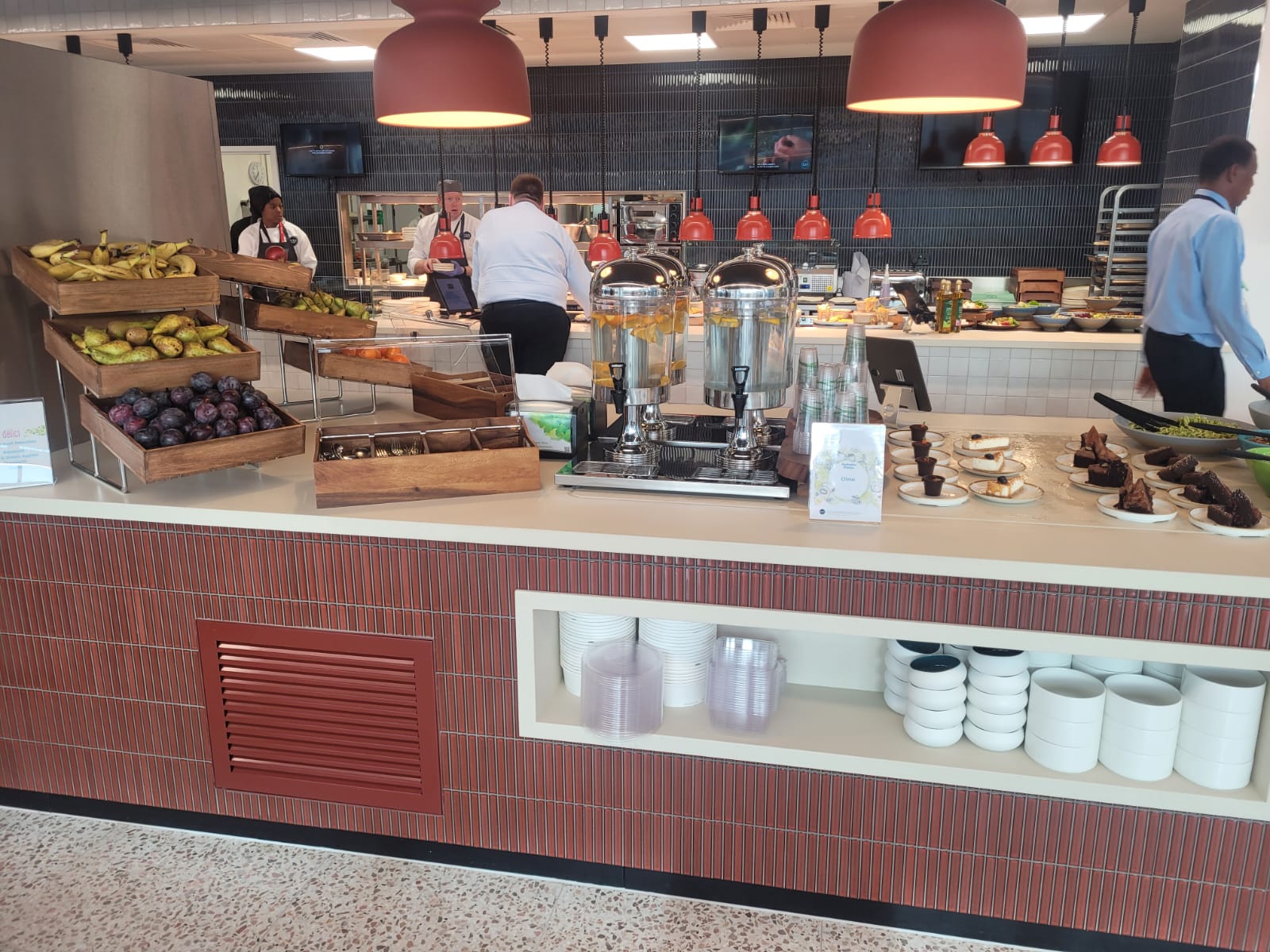 Back-to-back ambient display cases and chilled multidecks installed at Equinor's London headquarters, showcasing beverages and merchandise.